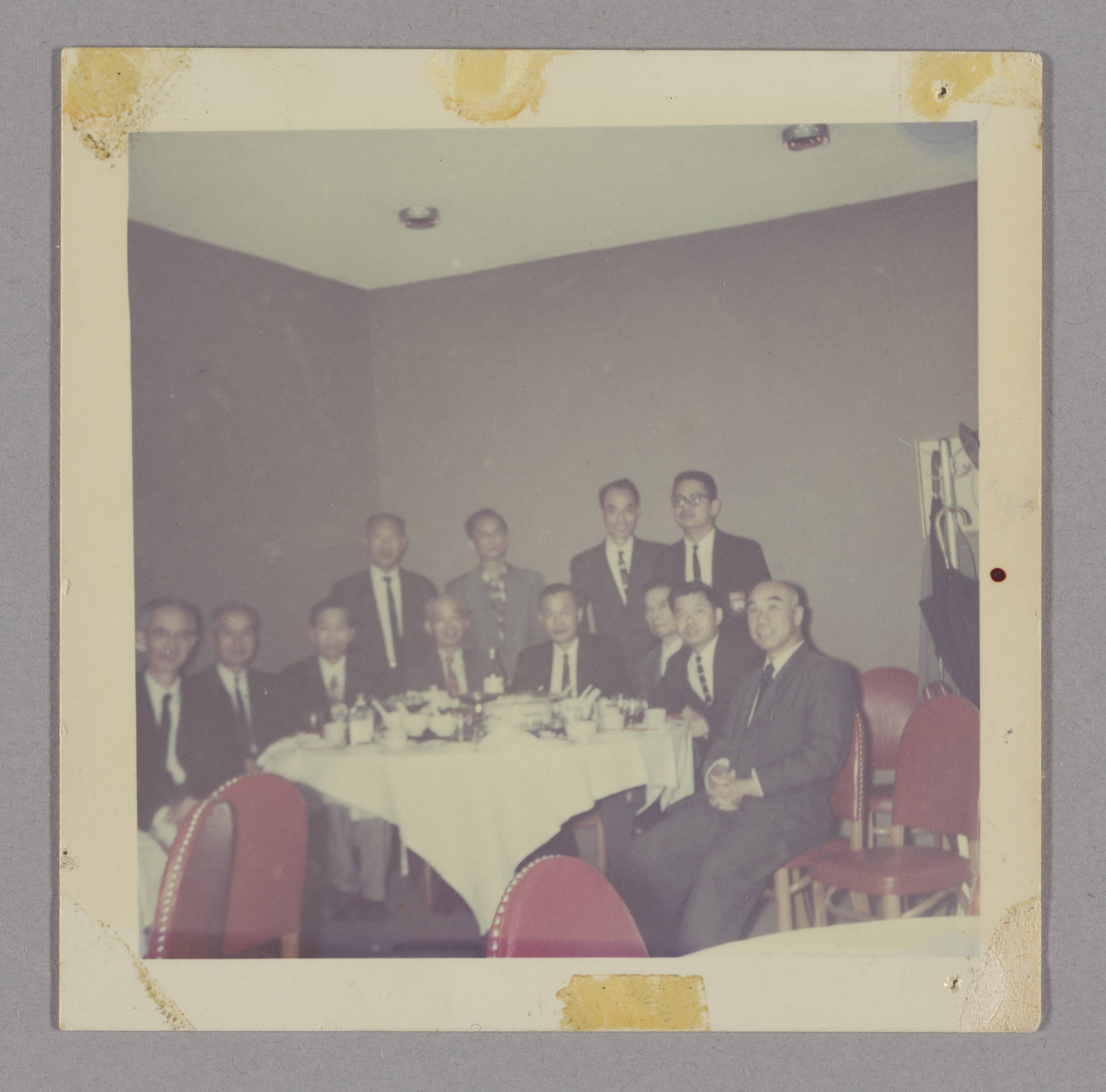 Commemorative gathering at Kwok Wah restaurant, San Francisco (五祖誕鐘鼓特刊二周年紀念). Small banquet group; original print fading preserved as received.