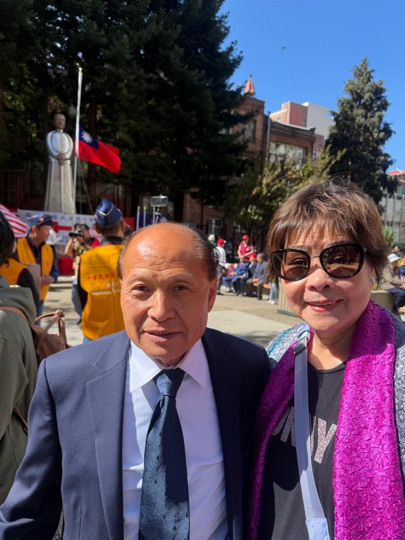 Two attendees at an outdoor Double Ten celebration